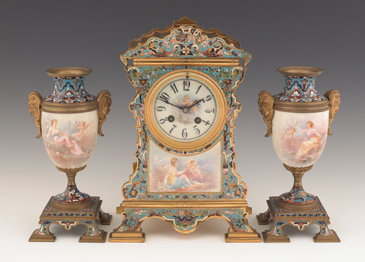 French enameled brass and painted porcelain three-piece clock garniture. Estimate: $500-$1,000. Image courtesy of Pook & Pook Inc.